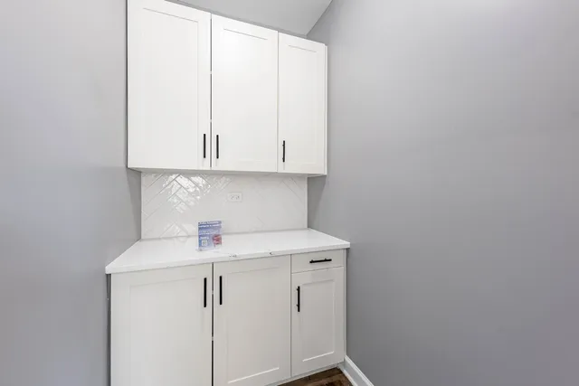 a kitchen with stainless steel appliances kitchen island a refrigerator and a stove