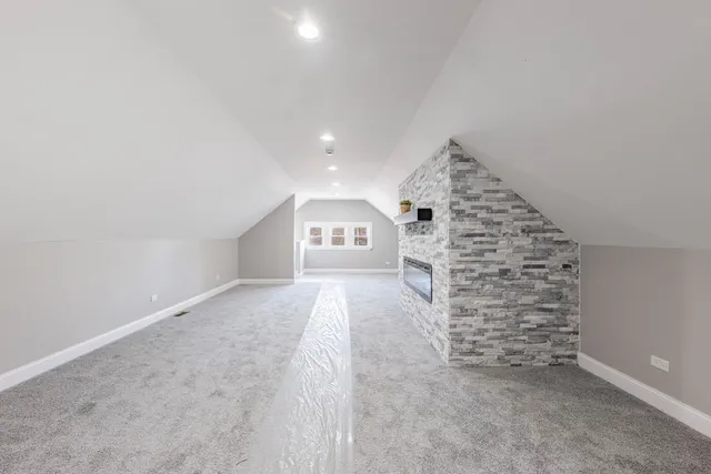 a view of an empty room with a fireplace