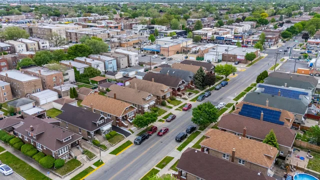 an aerial view of residential houses with outdoor space