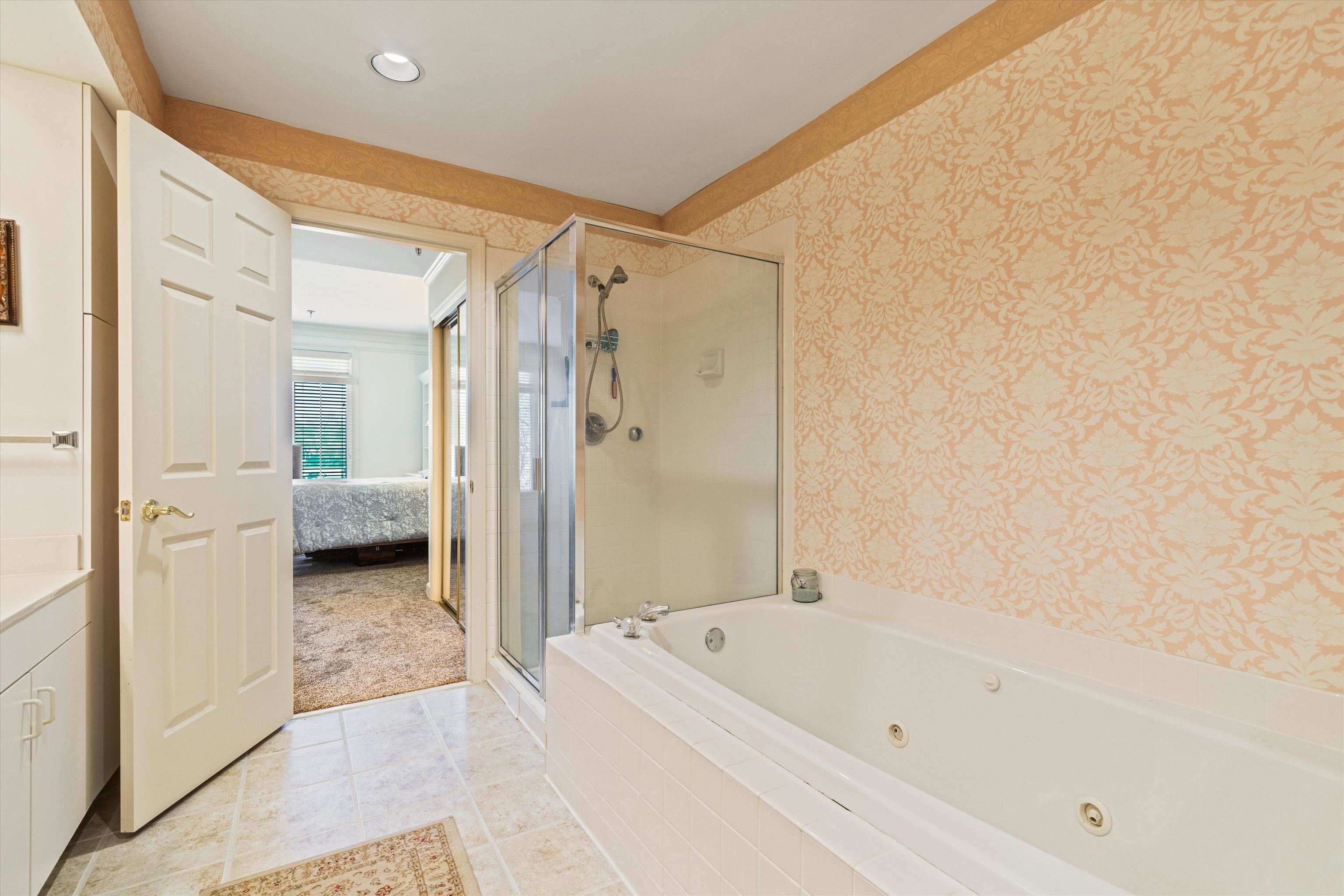 405 South Perkins Road, Unit 250 Memphis, TN 38117 - Photo 14 of 19 a bathroom with a bathtub and a shower