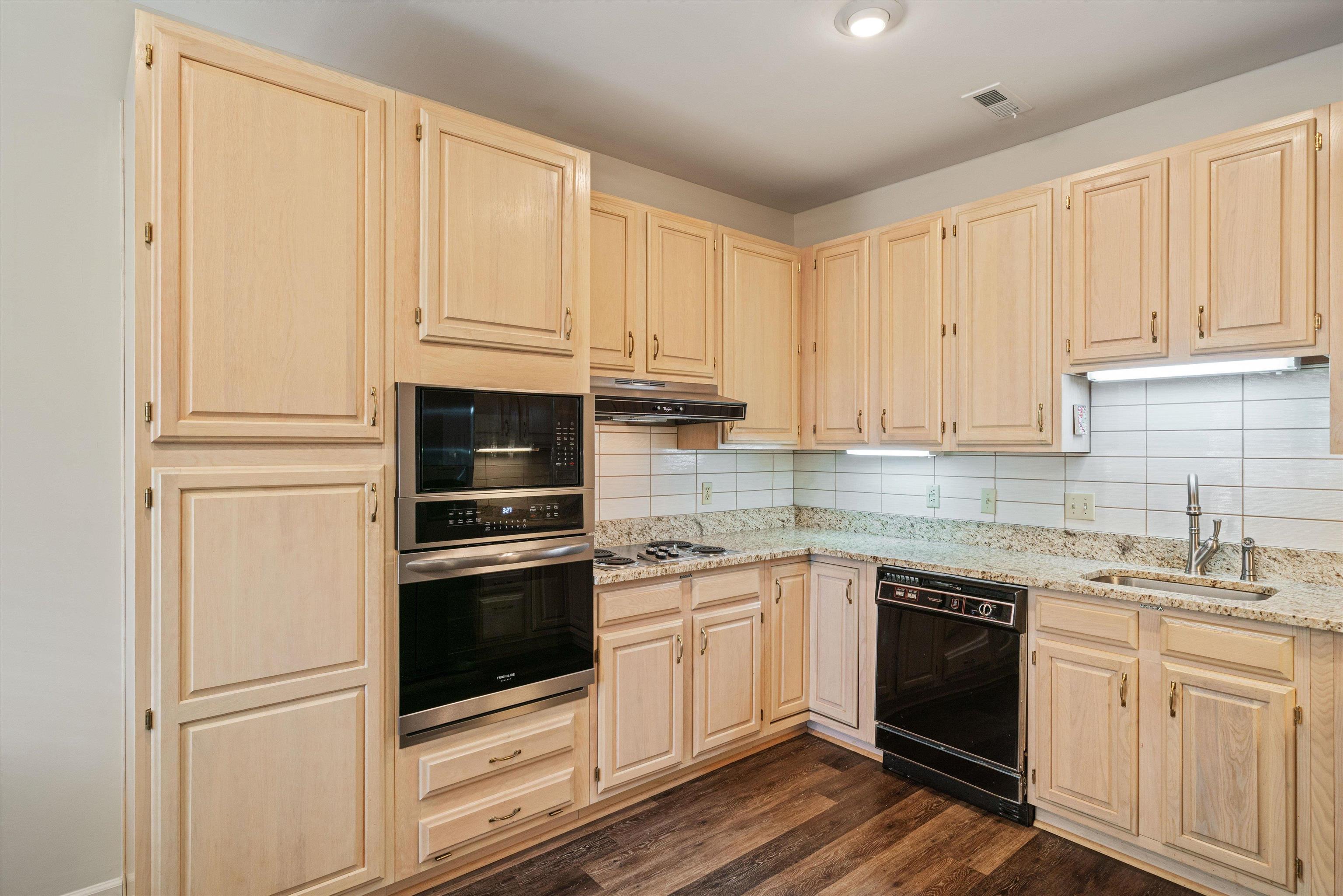 405 South Perkins Road, Unit 250 Memphis, TN 38117 - Photo 10 of 19 a kitchen with granite countertop white cabinets stainless steel appliances and sink