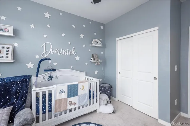 a bedroom with furniture and a chandelier