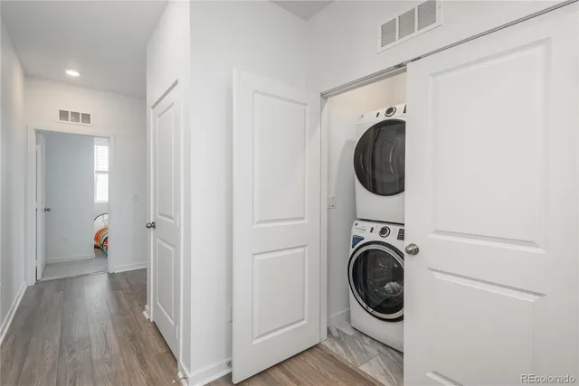 a view of a hallway with washer and dryer