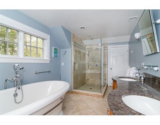 18 Ivy Road Wellesley, MA 02482 - Photo 14 of 21 a bathroom with a granite countertop sink mirror and a bathtub