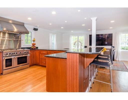 18 Ivy Road Wellesley, MA 02482 - Photo 3 of 21 a kitchen with stainless steel appliances granite countertop a stove top oven and sink