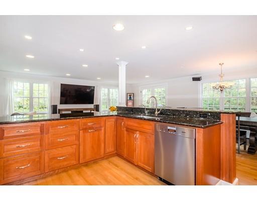 18 Ivy Road Wellesley, MA 02482 - Photo 4 of 21 a kitchen with stainless steel appliances granite countertop a stove a sink and a microwave