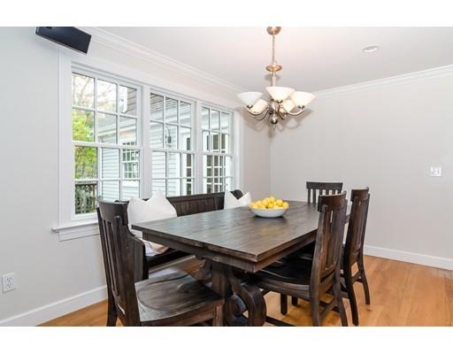 18 Ivy Road Wellesley, MA 02482 - Photo 8 of 21 a view of a dining room with furniture a chandelier and wooden floor