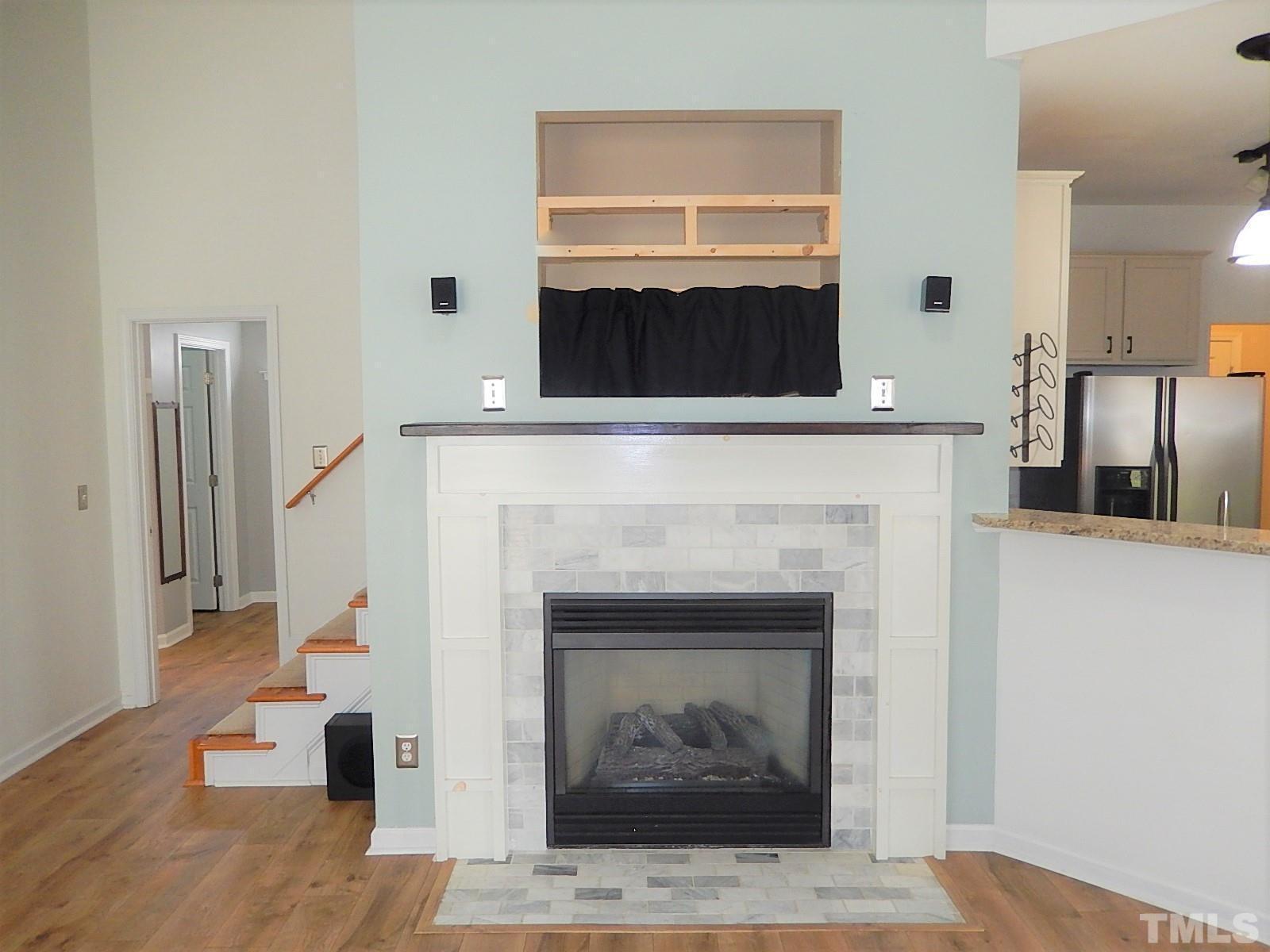 4717 Delta Ridge Court Raleigh, NC 27612 - Photo 5 of 30 a living room with furniture and a fireplace