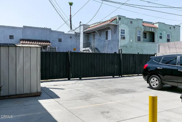 a view of front door and wooden deck
