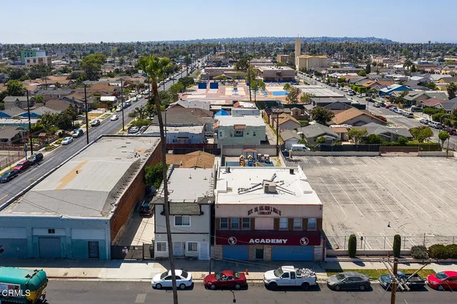 a kitchen with stainless steel appliances granite countertop a refrigerator and a stove