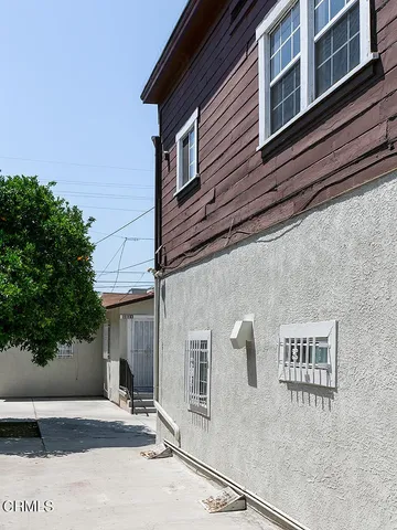 a view of a building with a tree