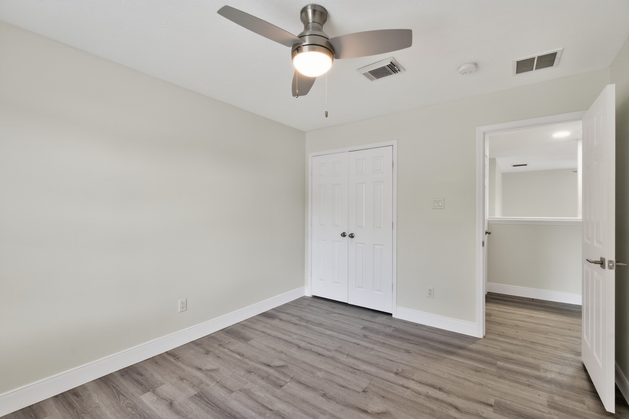 918 Ivycroft Lane Spring, TX 77373 - Photo 29 of 33 an empty room with wooden floor ceiling fan and window