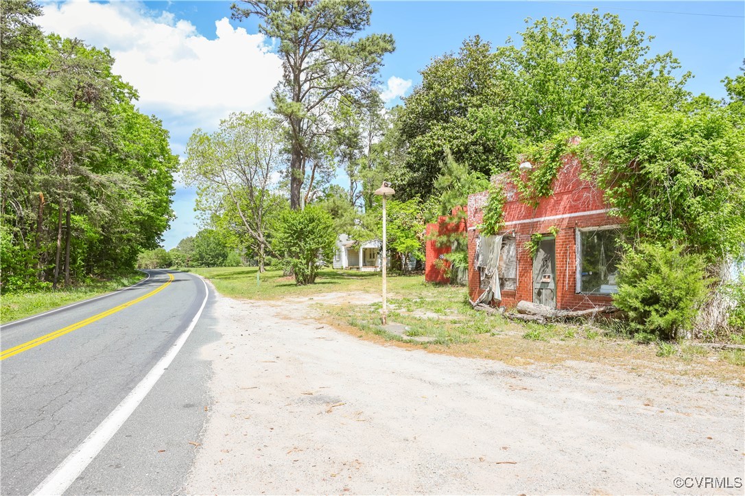 a view of a house with basketball court