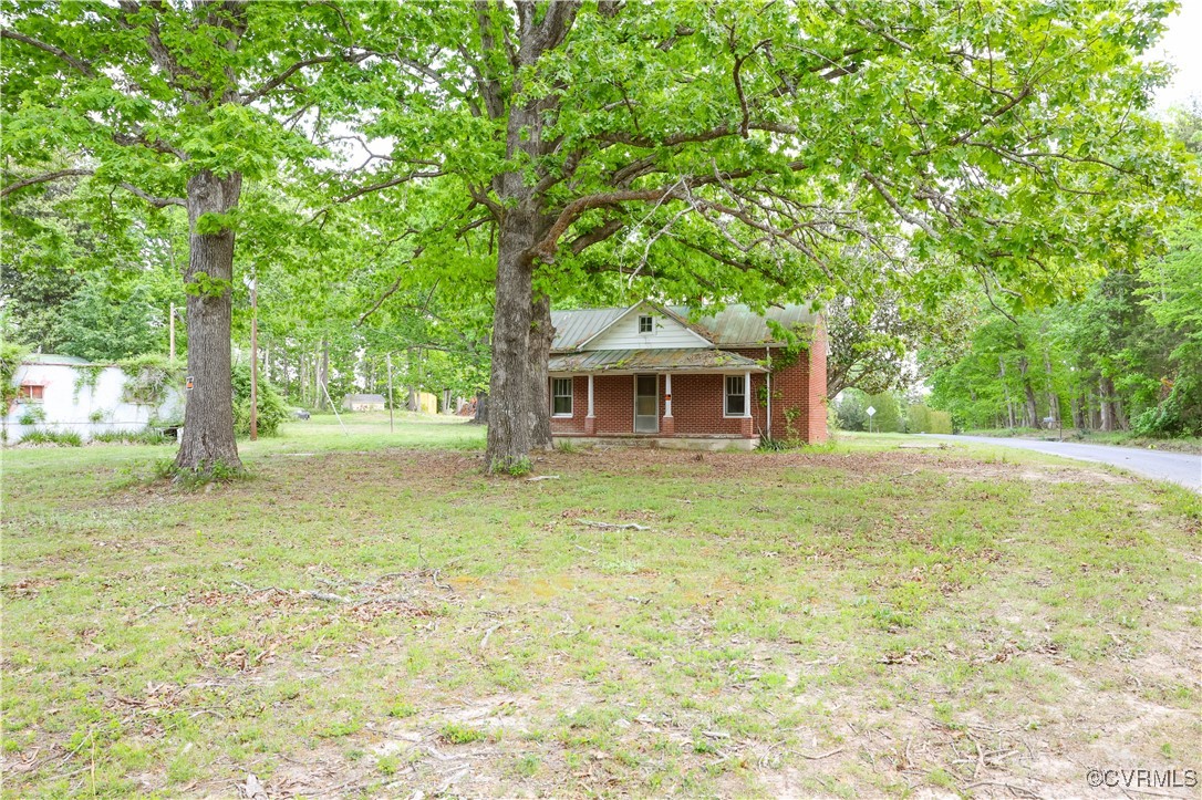 Tbd Abilene Road Farmville, VA 23901 - Photo 12 of 29 a backyard of a house with table and chairs