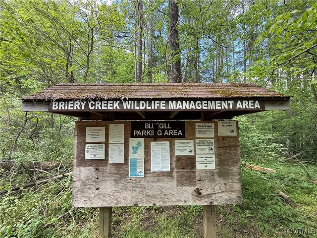 a view of a house with a tub and trees