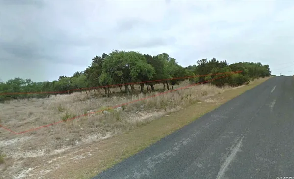 a view of a road with a yard