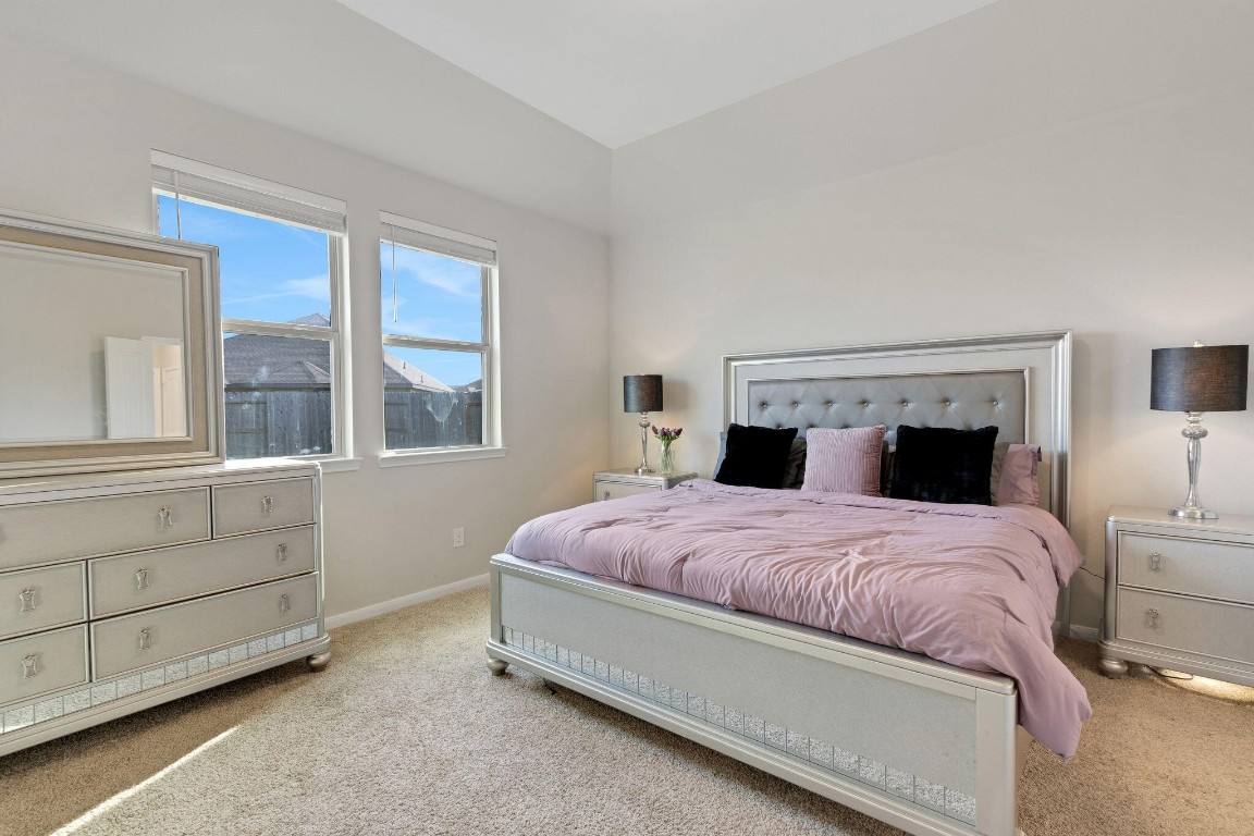 4510 Red Yucca Drive Baytown, TX 77521 - Photo 11 of 29 a bedroom with a bed and window