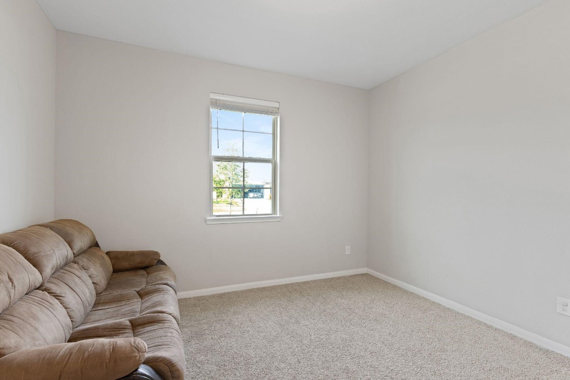 4510 Red Yucca Drive Baytown, TX 77521 - Photo 16 of 29 a living room with furniture and a window
