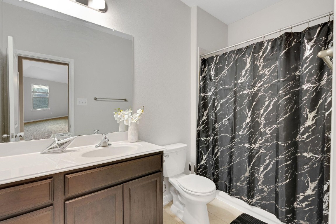 4510 Red Yucca Drive Baytown, TX 77521 - Photo 17 of 29 a bathroom with a sink and a mirror