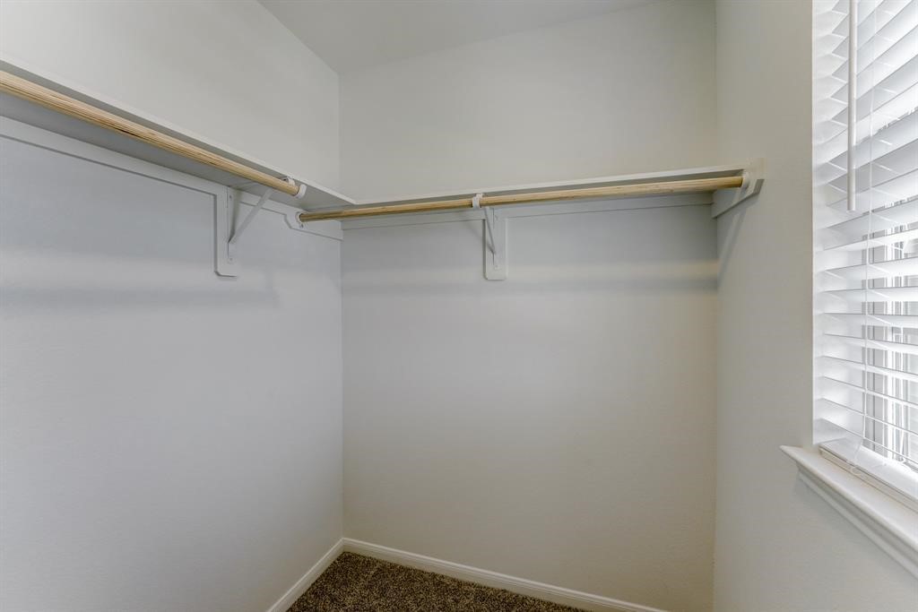 4510 Red Yucca Drive Baytown, TX 77521 - Photo 23 of 29 a view of a room with rack on the wall and a window