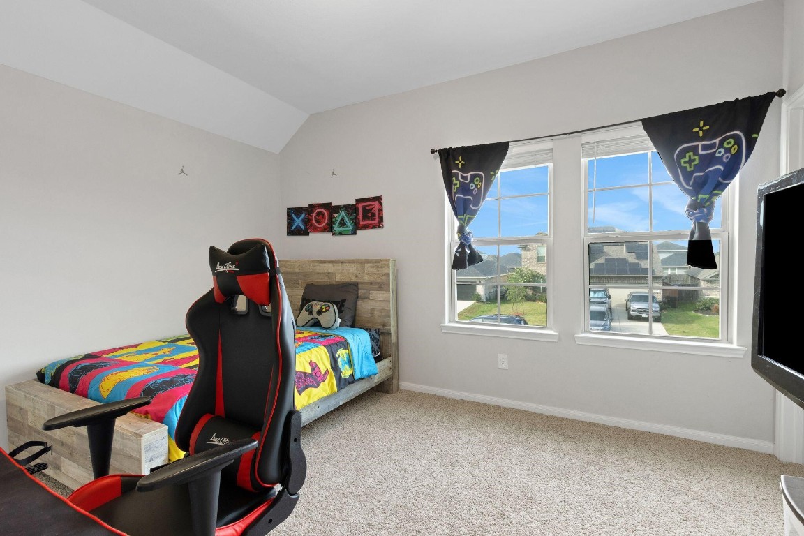 4510 Red Yucca Drive Baytown, TX 77521 - Photo 24 of 29 a bedroom with a bed and a window