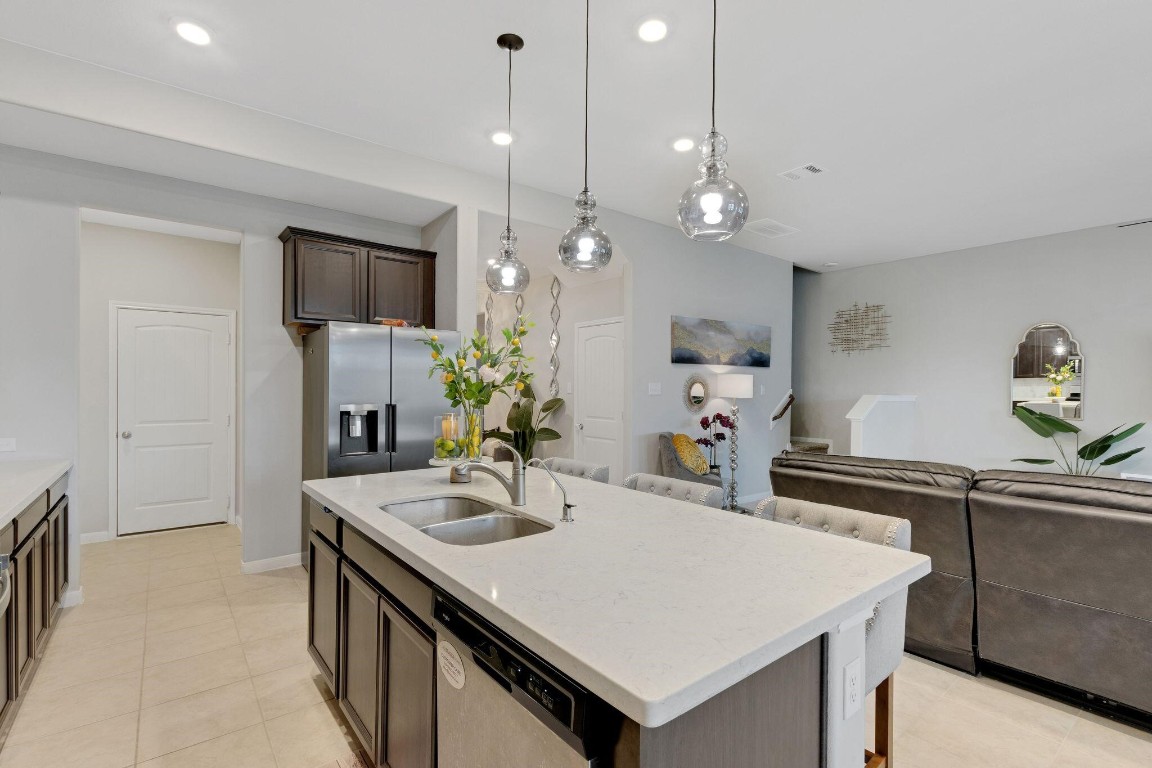 4510 Red Yucca Drive Baytown, TX 77521 - Photo 7 of 29 a kitchen with a sink a center island and cabinets
