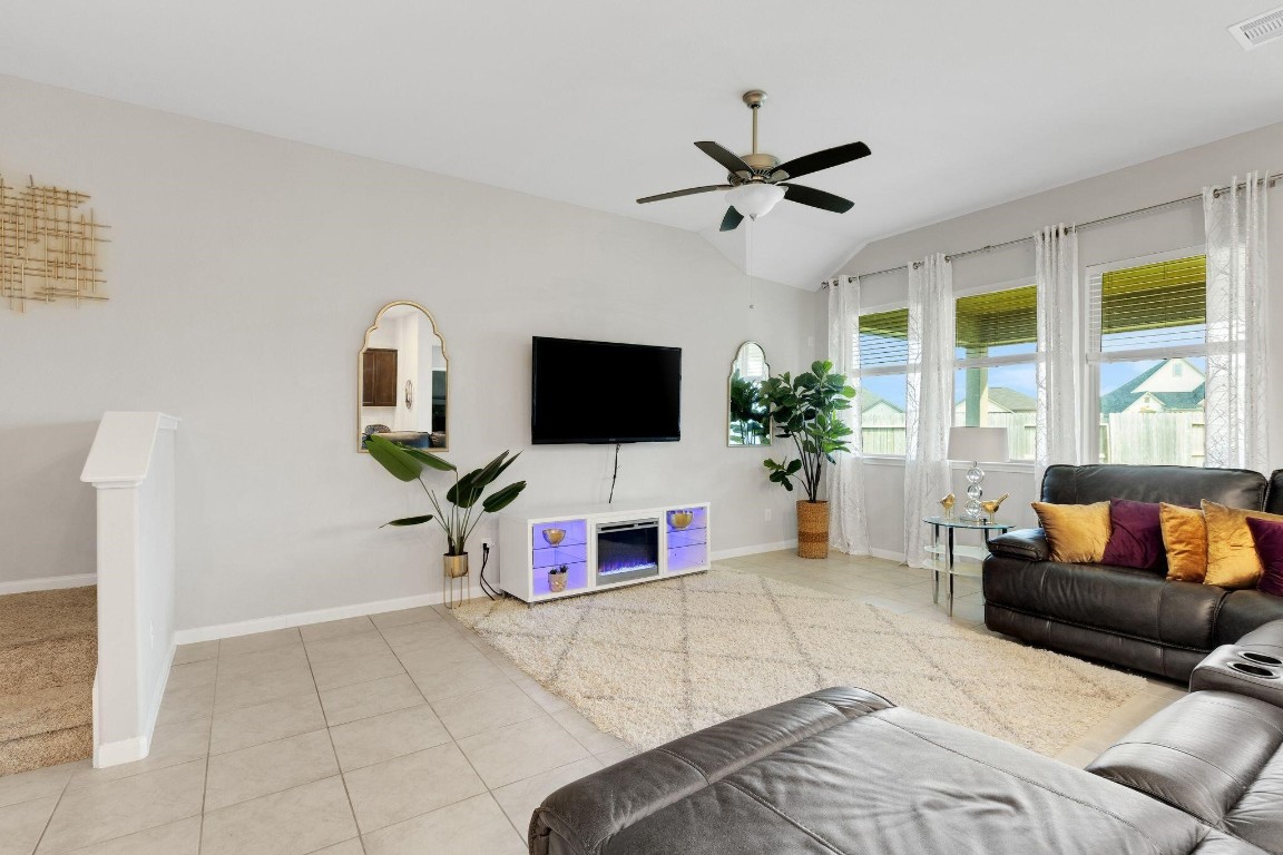 4510 Red Yucca Drive Baytown, TX 77521 - Photo 10 of 29 a living room with furniture and a flat screen tv