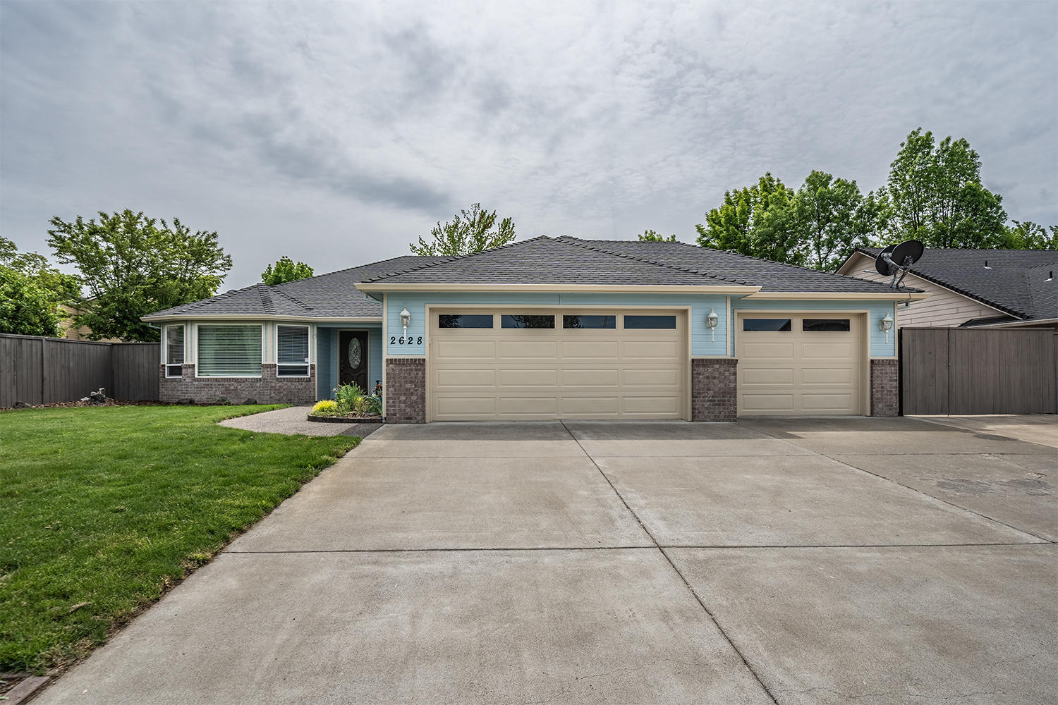 2628 Beebe Road Central Point, OR 97502 - Photo 1 of 27 a front view of a house with a garden and yard