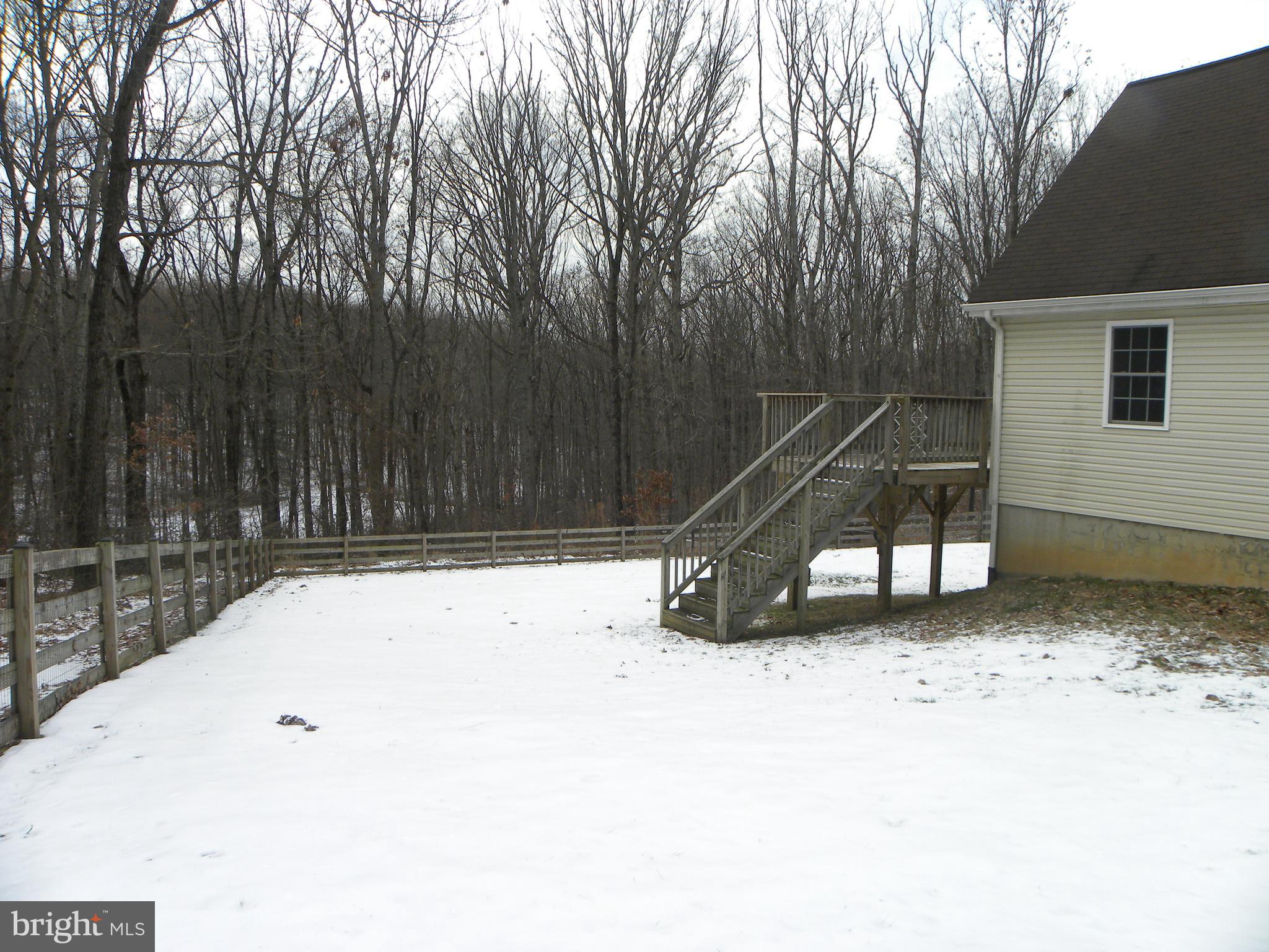 3906 Hooper Road New Windsor, MD 21776 - Photo 7 of 12 Side yard - deck off of primary bedroom