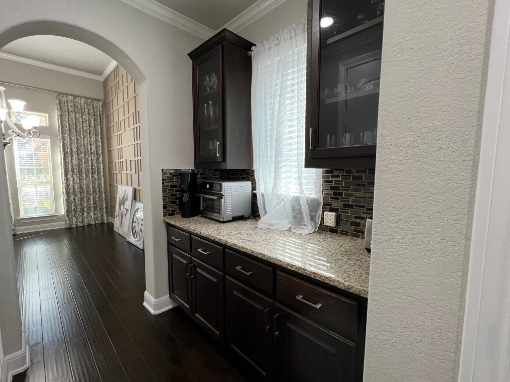 4121 Cappello Way Leander, TX 78641 - Photo 15 of 40 a view of a kitchen from the hallway