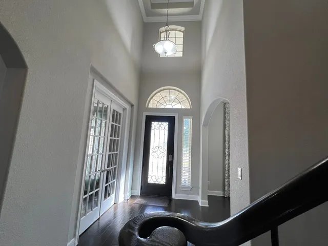 a bedroom with furniture and a window