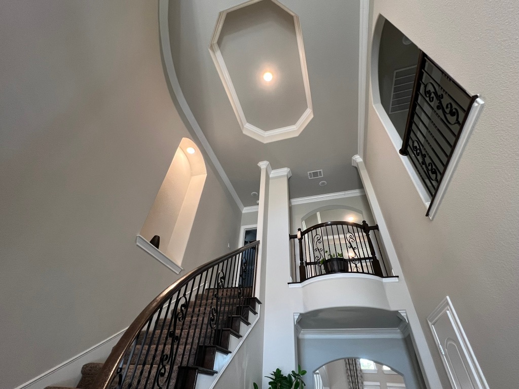 4121 Cappello Way Leander, TX 78641 - Photo 21 of 40 a view of staircase with wooden floor and white walls
