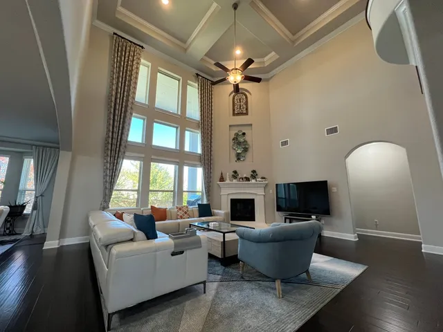 a living room with furniture and a fireplace