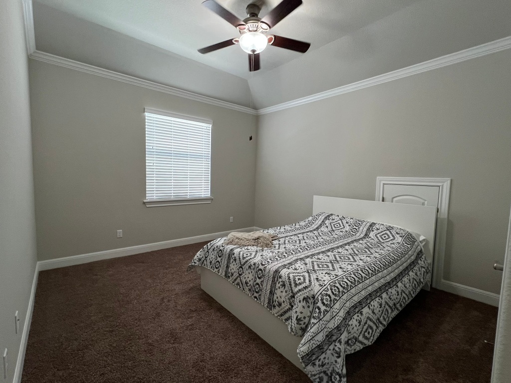 4121 Cappello Way Leander, TX 78641 - Photo 31 of 40 a bed sitting in a bedroom next to a window