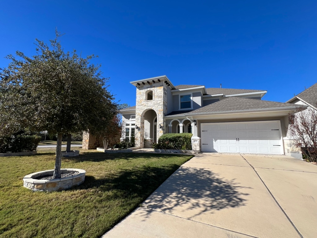 4121 Cappello Way Leander, TX 78641 - Photo 37 of 40 a front view of a house with a yard