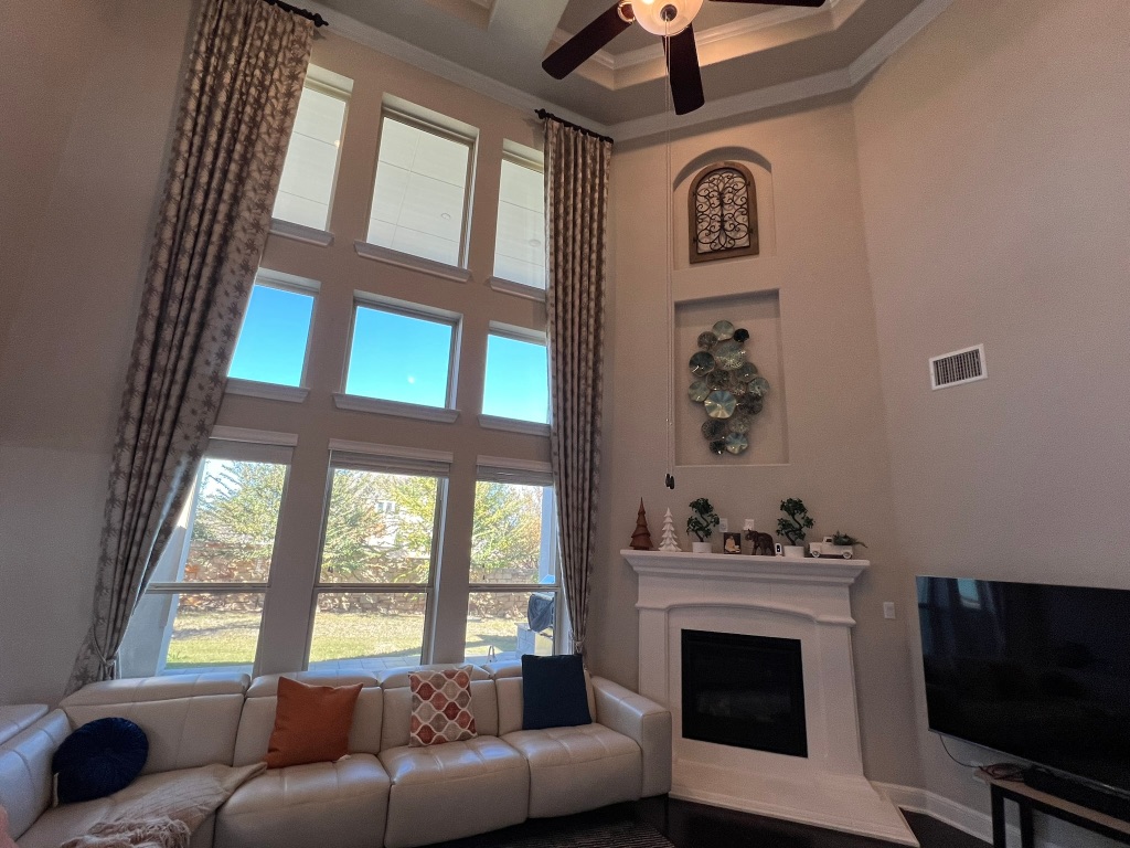 4121 Cappello Way Leander, TX 78641 - Photo 6 of 40 a living room with furniture a fireplace and a flat screen tv