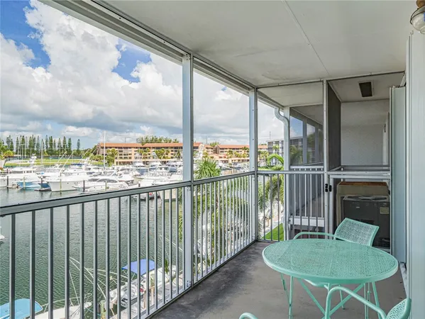 a view of a chair and table in the balcony
