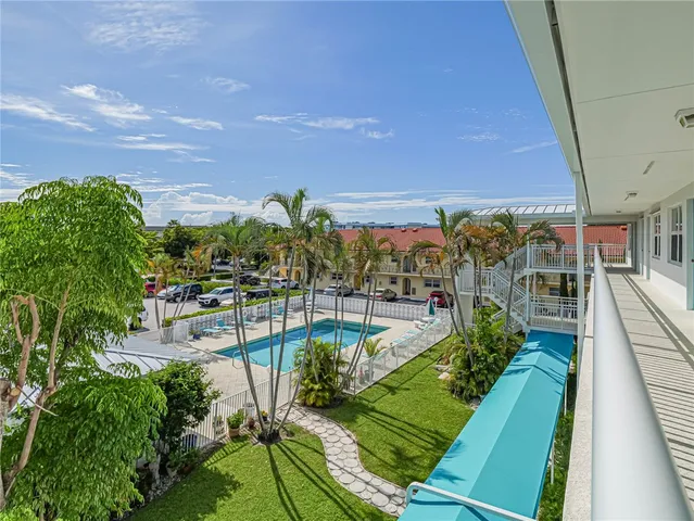 a view of a swimming pool with a patio