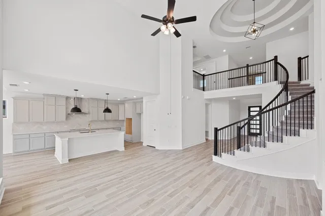 a view of kitchen with sink microwave and stove
