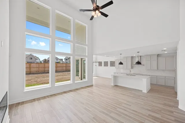 a view of kitchen with furniture and wooden floor