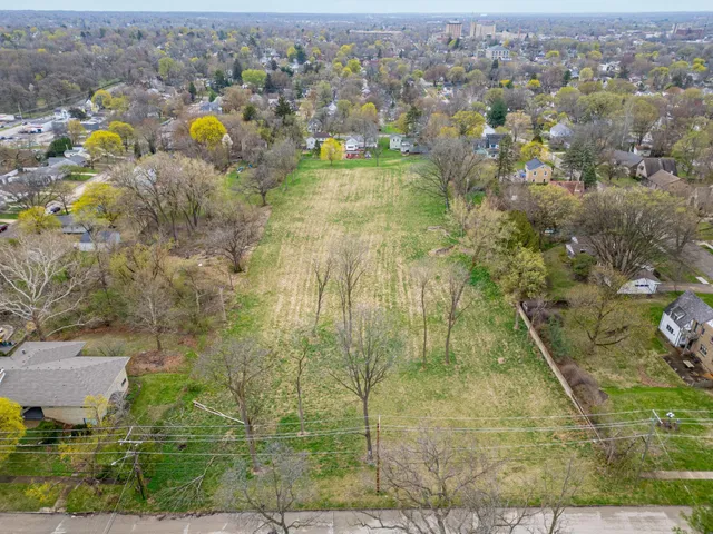 an aerial view of a residential houses with outdoor space