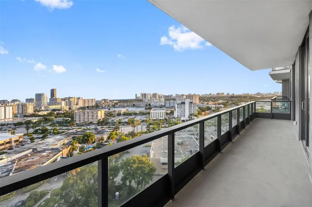 a view of a room with wooden floor and balcony