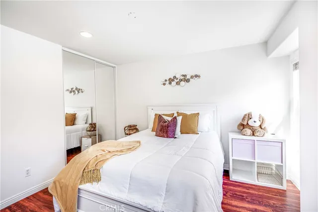 a bedroom with a bed and a couch