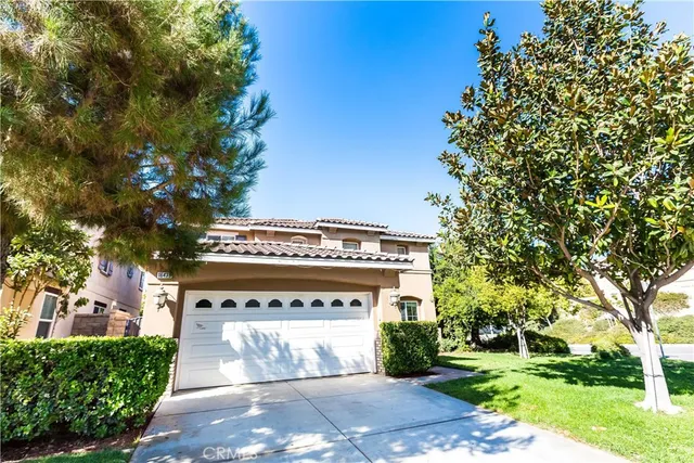 a front view of a building with garden