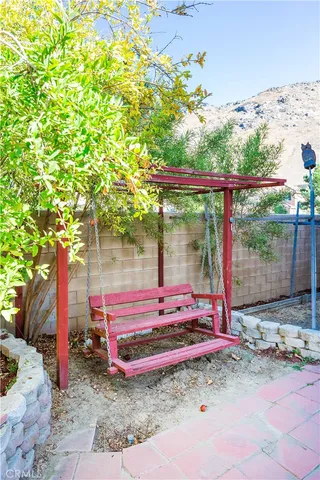 a view of a bench in a backyard