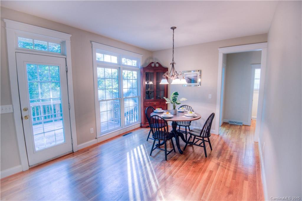 915 Derricks Crossing Fort Mill, SC 29708 - Photo 12 of 24 a view of a dining room with furniture window and wooden floor
