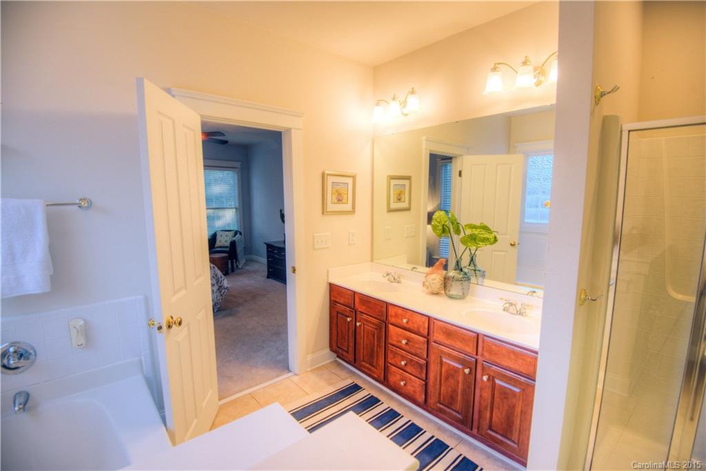 915 Derricks Crossing Fort Mill, SC 29708 - Photo 15 of 24 a bathroom with a double vanity sink and a mirror