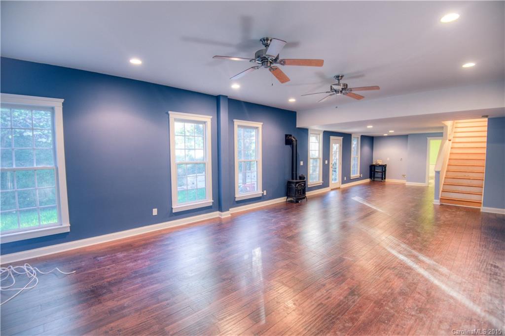 915 Derricks Crossing Fort Mill, SC 29708 - Photo 16 of 24 a view of an empty room with window and wooden floor