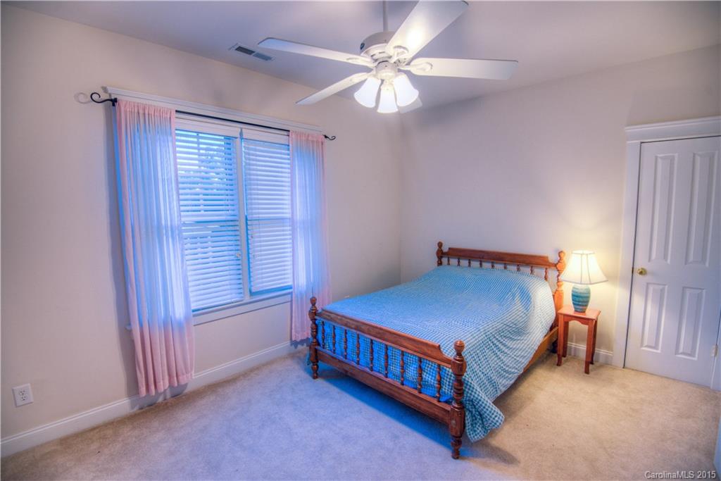 915 Derricks Crossing Fort Mill, SC 29708 - Photo 20 of 24 a bed sitting in a room next to a window