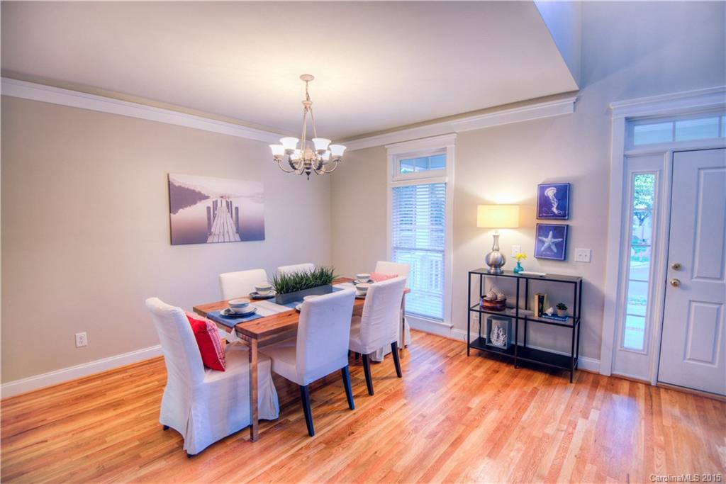 915 Derricks Crossing Fort Mill, SC 29708 - Photo 5 of 24 a view of a dining room with furniture and wooden floor